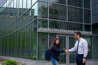 CCB exterior handshake faculty student