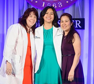Alumna Jacqueline Tran '15 at her white coat ceremony at UMass Medical, 2015.