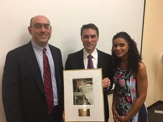 Dean Eric Mitnick accepting the Massachusetts Bar Association Public Service Award on behalf of UMass Law.