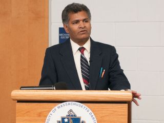 Professor Satya Parayitam at podium