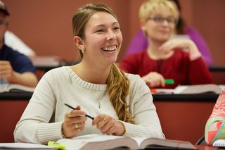 Female law student smiling in classroom