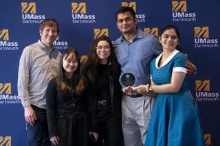A group of students with an award.