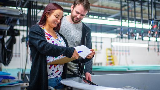 Research Associate, Amber Lisi, and Postdoctoral Fellow, Adam Delargy conducting research in the SMAST East Seawater lab