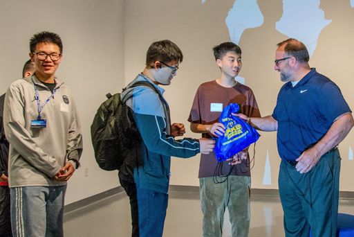 Hubei students receiving gifts