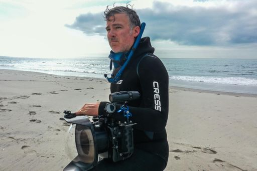 SMAST PhD grad on beach