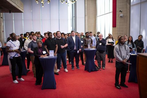Students listening to speech at networking event