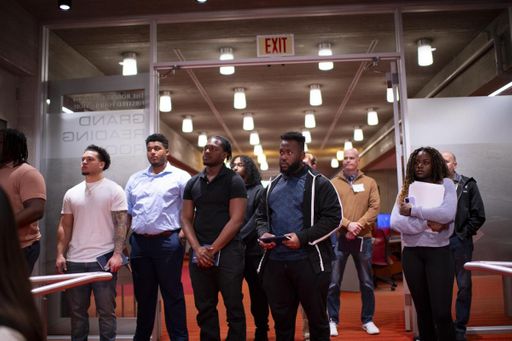 Students listening to speech at networking event