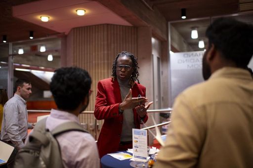 Alumni and students speaking at networking event