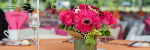 Pink flower centerpiece from Celebrating Jean's Legacy: A celebration honoring Jean MacCormack as UMass Dartmouth's longest-serving chief executive.