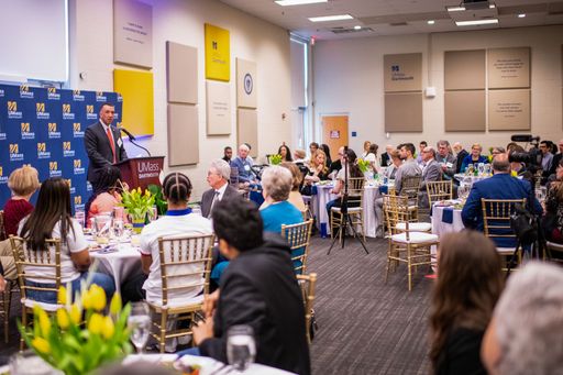 Dean Hickey presenting at the podium at the UMassD Scholarship Luncheon