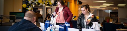 Students in the Grove visiting a vendor table