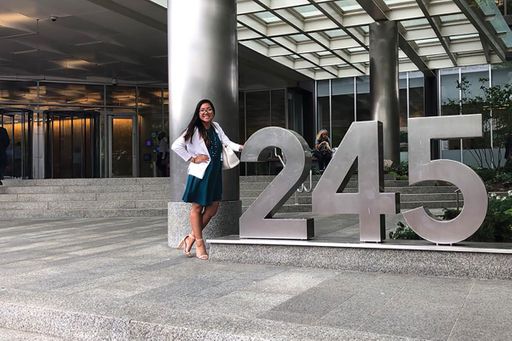 Person leaning against numbers