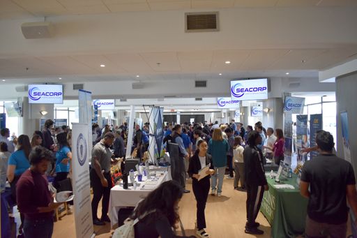 Students visiting tables at a career fair