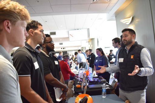 Students visiting tables at a career fair