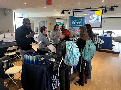 Students visiting tables at a career fair
