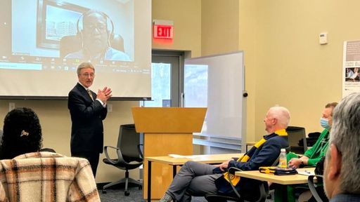 Charlton College of Business Dean John Williams welcomes students and crowd to the Charlton College of Business