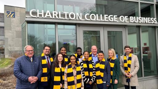 BayCoast scholars pose with BayCoast C.E.O. Nicholas Christ and other senior leaders outside the Charlton College of Business