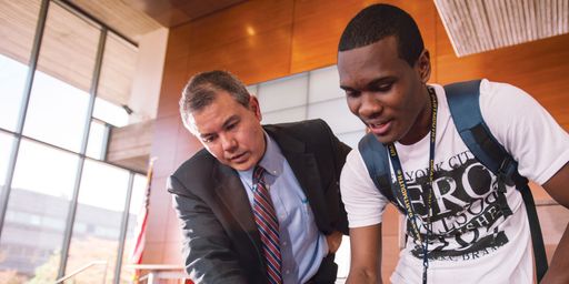 Paul Bacdayan working with a student