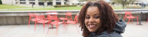 Student outside Claire T. Carney Library