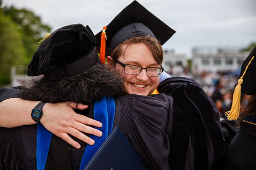 Faculty and student on commencement day