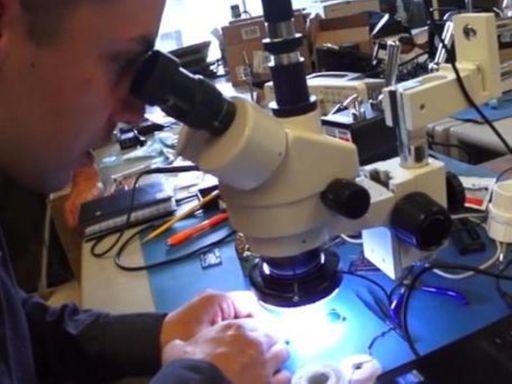 Student looking through a microscope