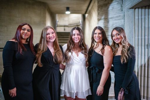 ABSN graduates gathering for a photo pre-ceremony
