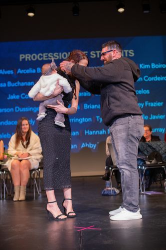 ABSN graduate being pinned on stage.