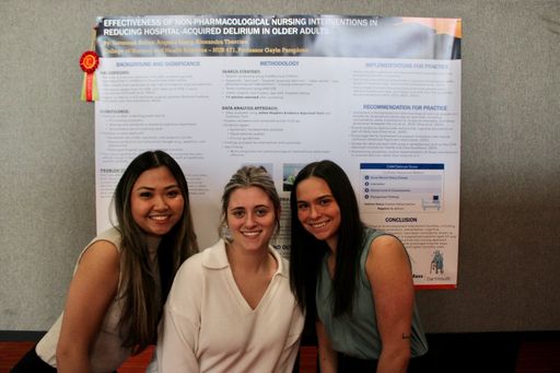 Nursing students with their research poster at Scholarship Day 2026