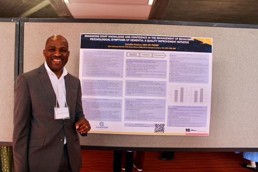 Nursing student with his research poster at 2026 Scholarship Day