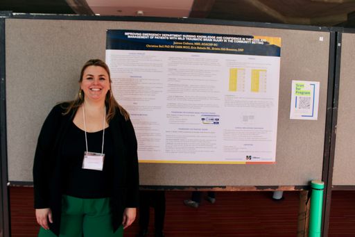 Nursing student with her research poster at the 2026 Scholarship Day