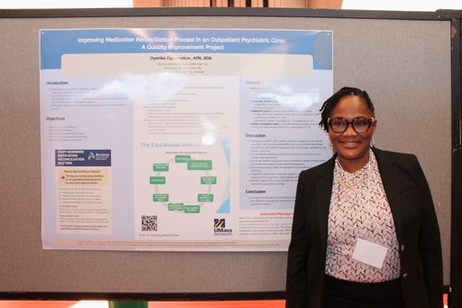 Nursing student with her research poster at the 2026 Scholarship Day