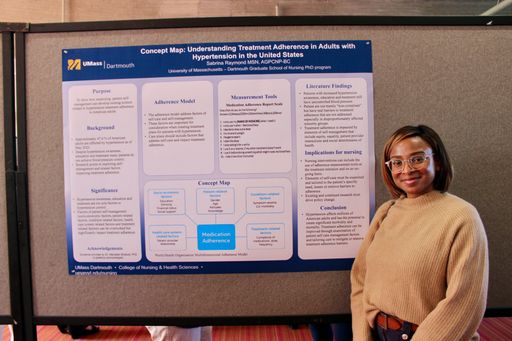 Nursing student with her research poster at the 2026 Scholarship Day