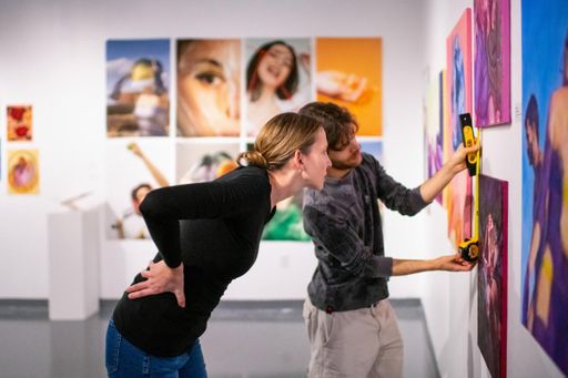 Professor Elena Peteva and Drawing student, Connor Chan '24 working on an installation in the CVPA gallery