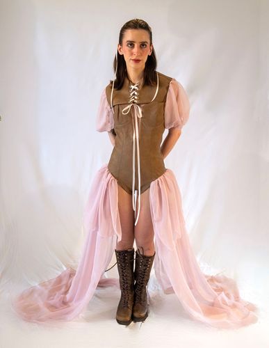 Look 3, 2026, brown leather bodysuit with chiffon sleeves and long chiffon panels extending from the sides.