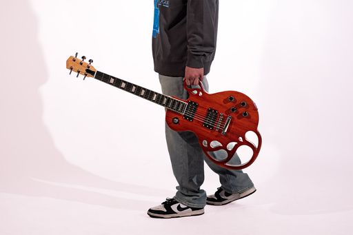 Chatterbox Guitar, 2026, photo of electric guitar, mahogany & maple wood, 14 x 9 in.