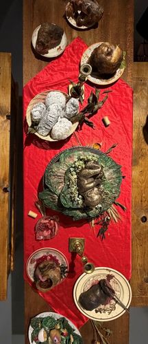 A MODEST BANQUET, 2026, mixed media piece based on the political essay A Modest Proposal by Johnathan Swift, 72 x 48 x 36 in.