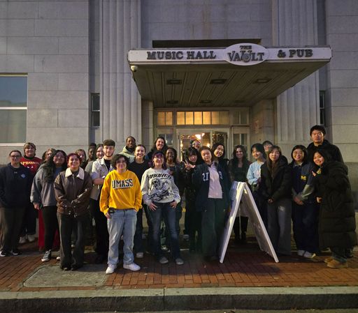 Student group photo outside The Vault entrance.