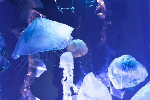 Blooms (detail), 2022, upcycled plastic, electric synchronous motors, filament, projection, screen, cellophane, led lights, sound, ~25’ x22’ x 10’