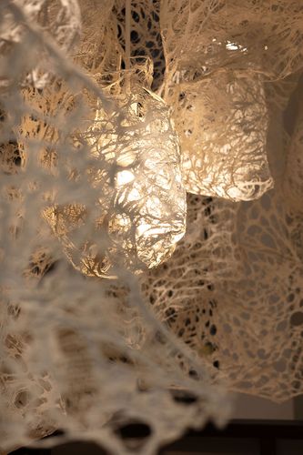 Enmeshed (detail), 2022, clay slip, cheese cloth, glue, led lights, wire, string, ~9’ x 10’ x 5’