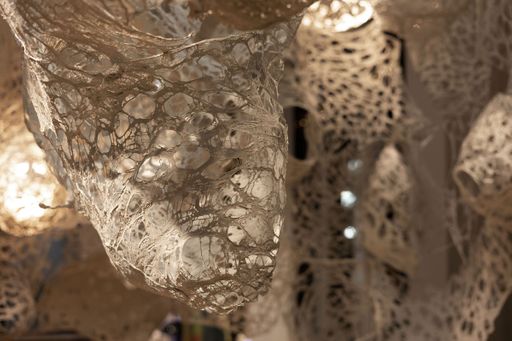 Enmeshed (detail), 2022, clay slip, cheese cloth, glue, led lights, wire, string, ~9’ x 10’ x 5’