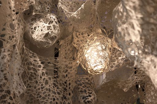 Enmeshed (detail), 2022, clay slip, cheese cloth, glue, led lights, wire, string, ~9’ x 10’ x 5’