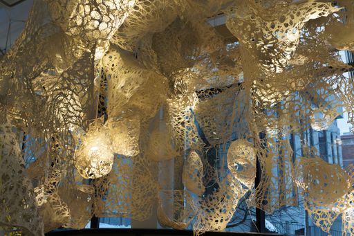 Enmeshed (detail), 2022, clay slip, cheese cloth, glue, led lights, wire, string, ~9’ x 10’ x 5’