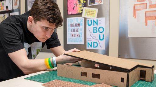 IAD student, James Paluzzi '26, working on an interior design project