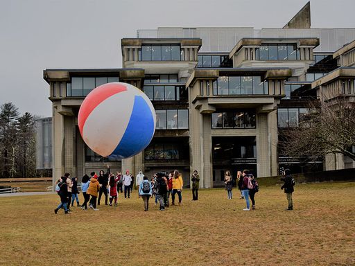 Participatory Art with Artist Negar Farajian, with giant beach ball on campus quad