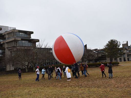 Participatory Art with Artist Negar Farajian, with giant beach ball on campus quad