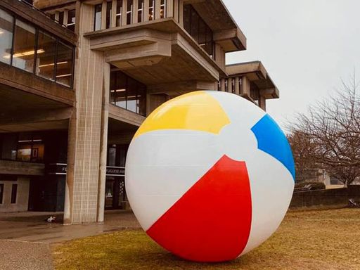 Participatory Art with Artist Negar Farajian, giant beach ball on campus quad