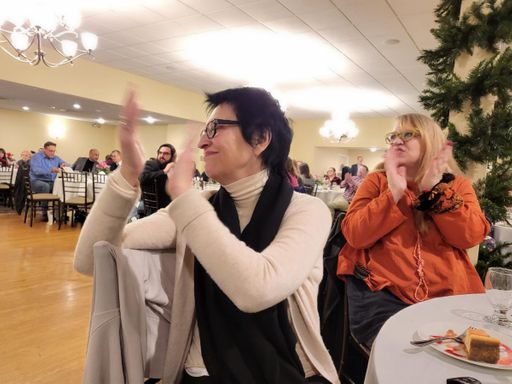 CVPA Professor Anna Dempsey claps in support of Pamela Karimi