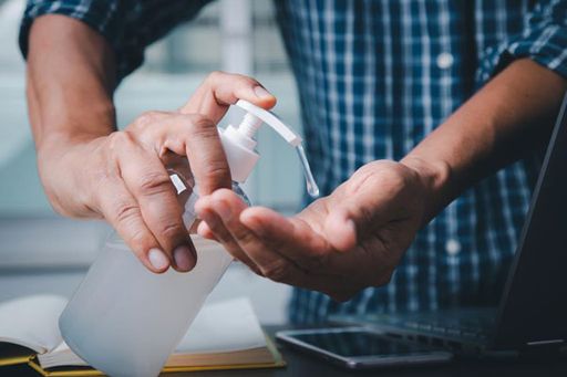 Person Sanitizing Their Hands