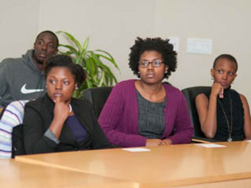 4 students at an Enactus weekly meeting in 2012