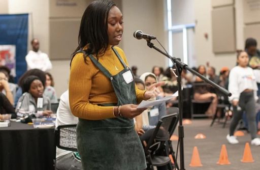 Student performing at S.P.E.A.K. event